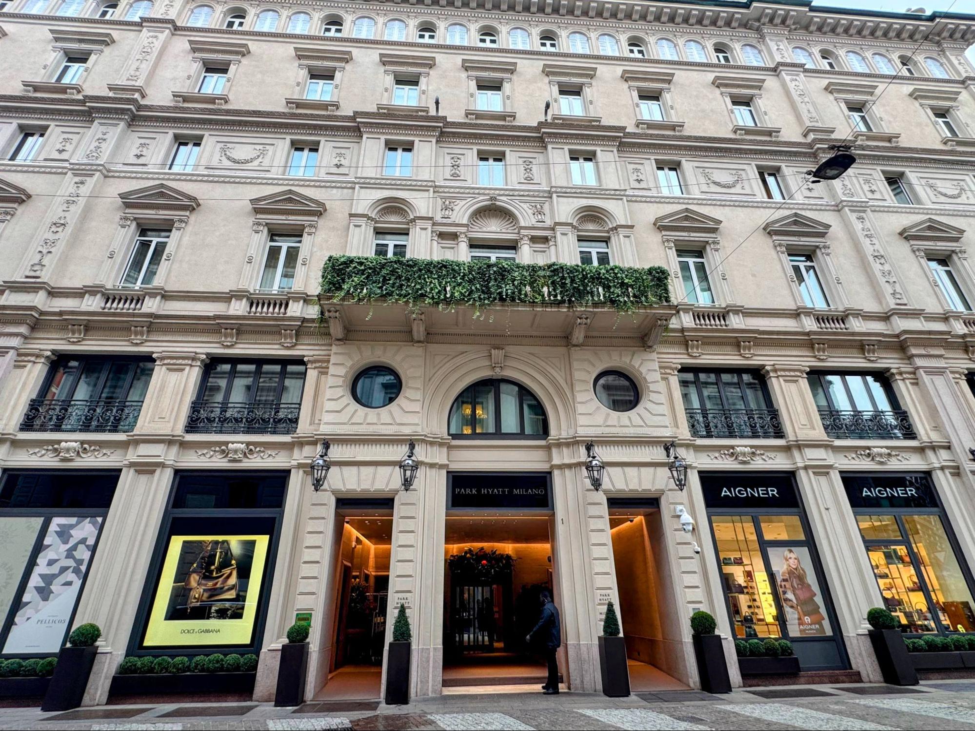Front view of the Park Hyatt Milan with signage above the entrance.